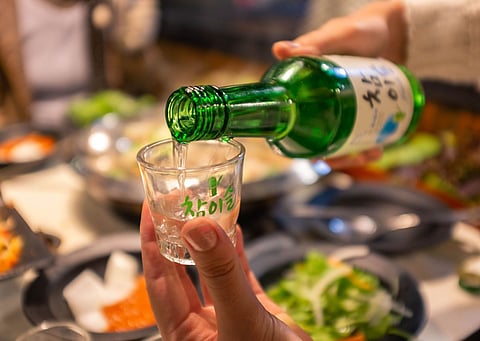 Soju shot being poured