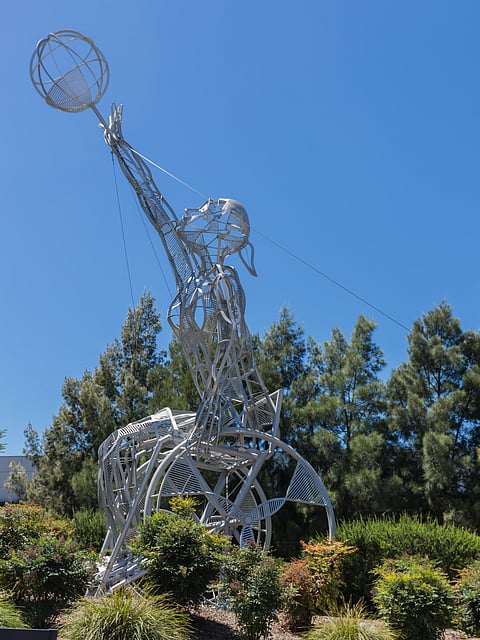 Giant metal sculptures of a gymnast in play at the Australian Institute of Sport (AIS)