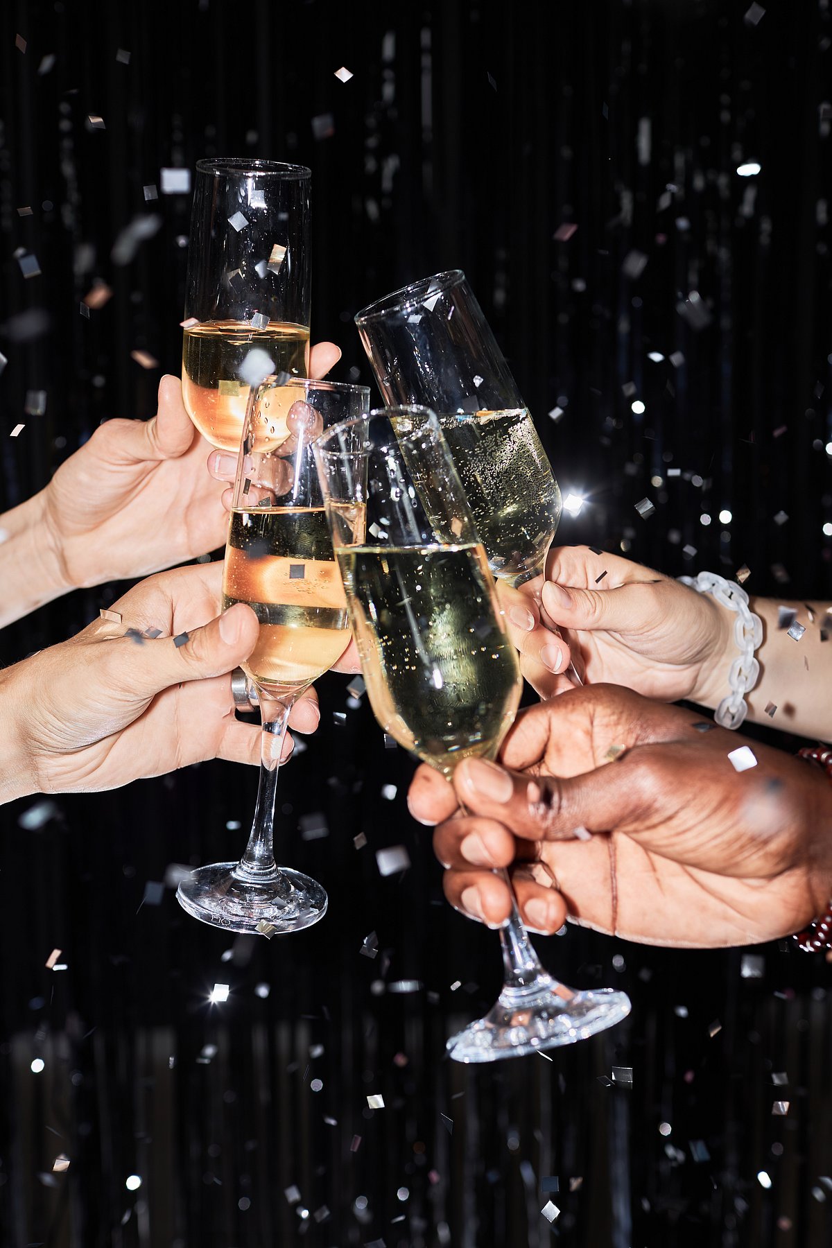 Shutterstock : A group of friends raise a toast