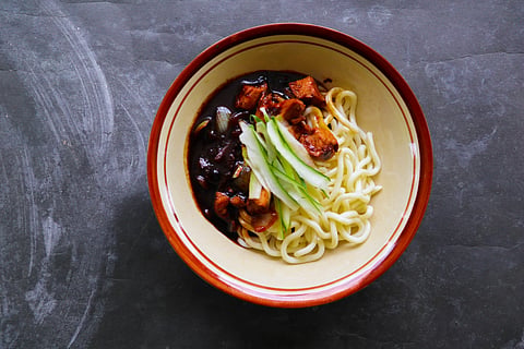 You can instantly recognise this dish through its dark, almost black sauce poured over thick wheat noodles