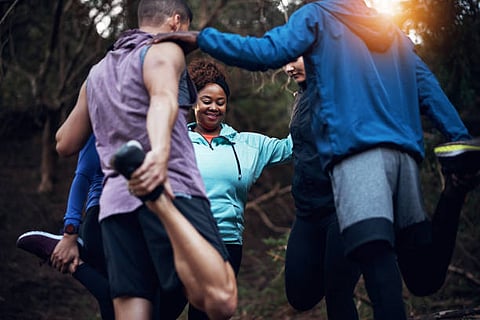A group of trail runners warming up together 