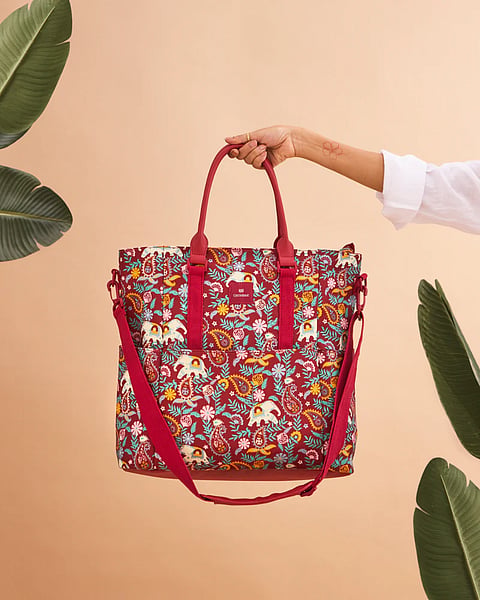The “Paisley Tucker” travel tote is large with multiple pockets for quick access to phones, keys, wallets, earbuds and other handy essentials