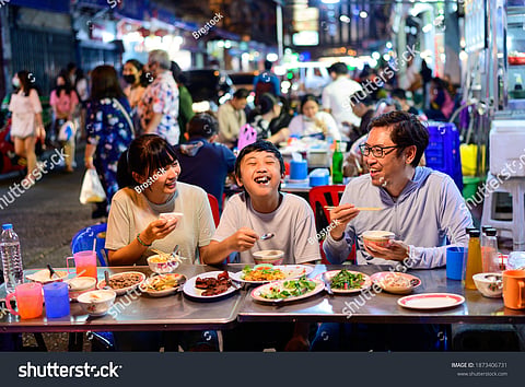 Families enjoying street food