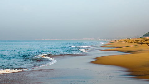 Take in the sunrise at Kollam beach