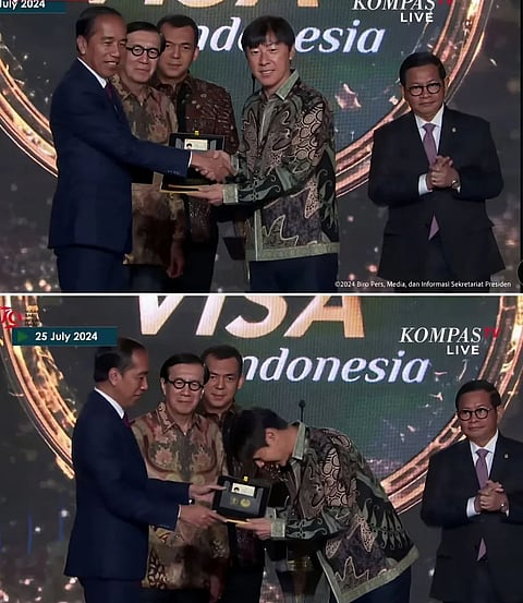 President Joko Widodo (far left) presents a "Golden Visa" to Shin Tae-yong, the South Korean coach of the Indonesian national football team