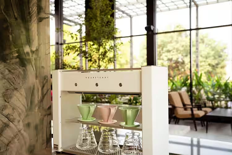 Karafa Coffee, an experiential coffee shop, serves a wide-ranging continental menu in a modern, glass-enclosed space