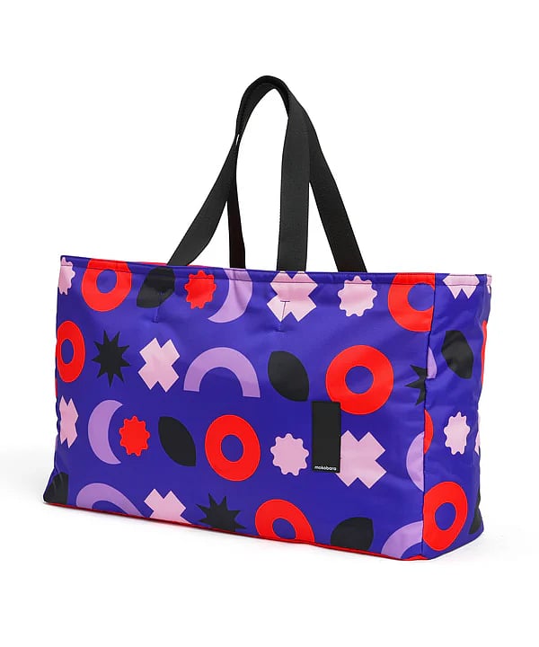 The “Cabana Travel Tote” is a large bag that is crafted with a premium water-resistant material