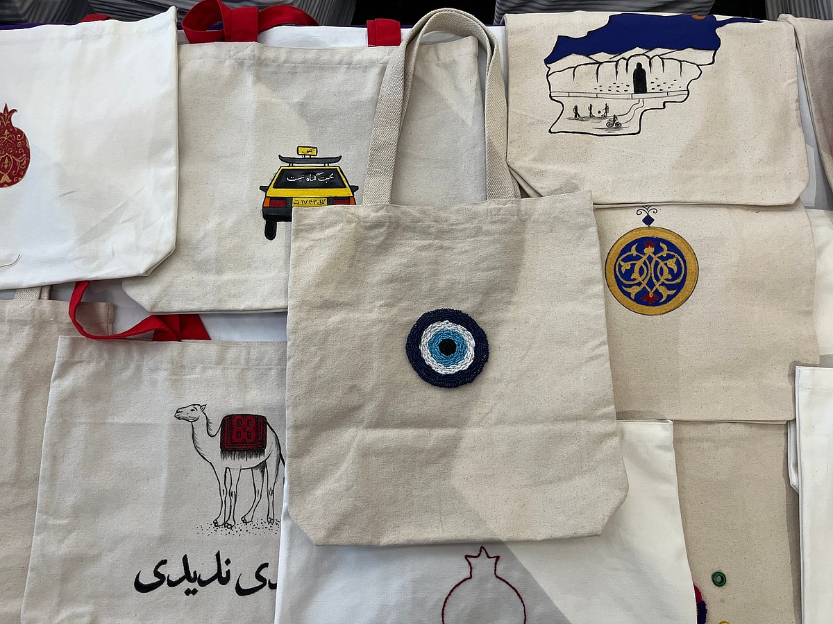 Maryam Kakar does the design and painting while Heela Kakar does the miniature art on the tote bags and notebooks