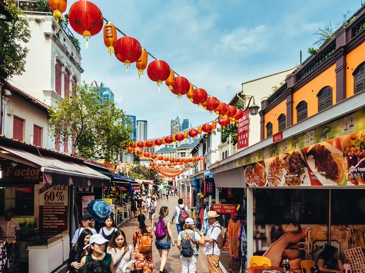 Tourists strolling around the various souvenir market stalls in Singapore Chinatown
