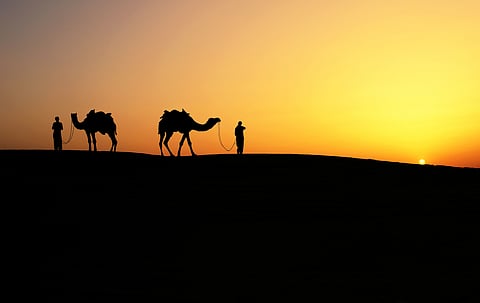 The dramatic landscape of the Khuri Sand Dunes at sunset
