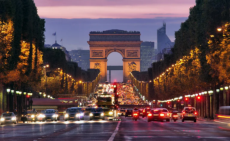 The Arc de Triomphe de l'Étoile stands at the western end of the Champs-Élysées in Paris - Ioan Panaite/Shutterstock