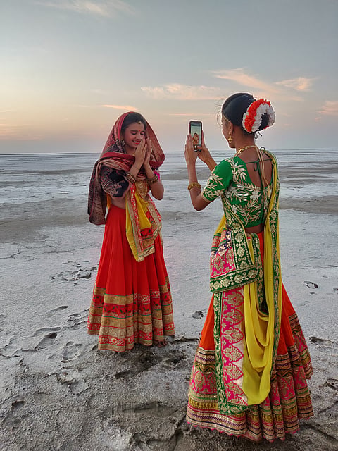 Folk dancers take a break during the Rann Utsav festivities