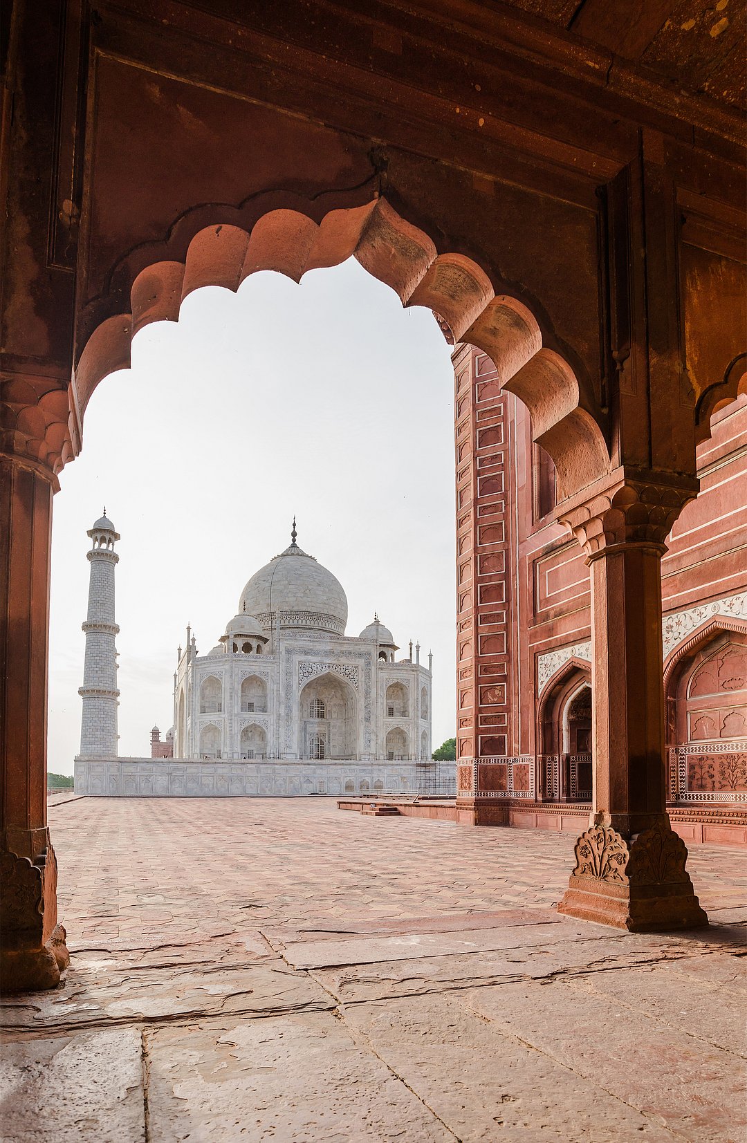 A view of the majestic Taj Mahal through an arch
