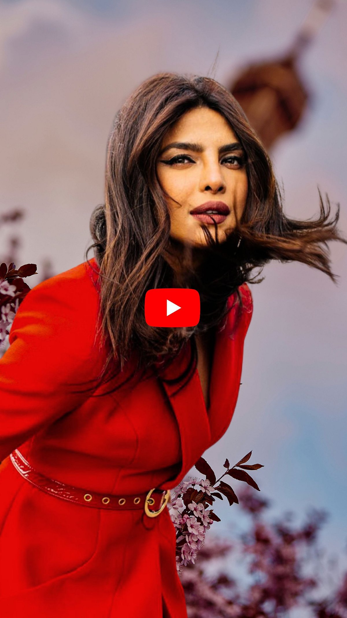 Outlook Traveller : Priyanka Chopra poses in a deep red dress