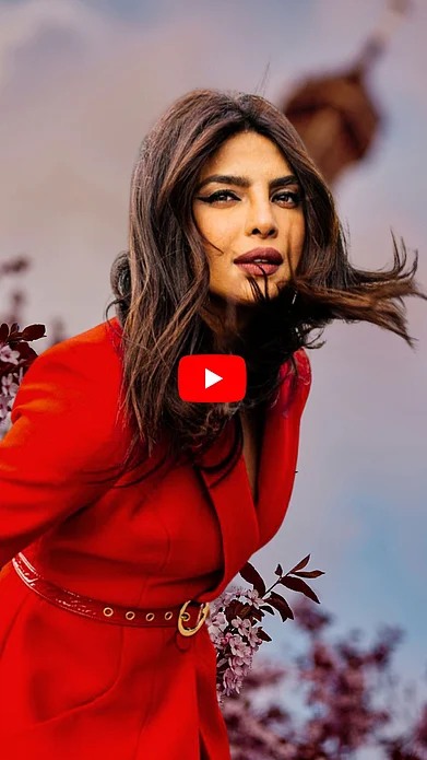 Outlook Traveller : Priyanka Chopra poses in a deep red dress