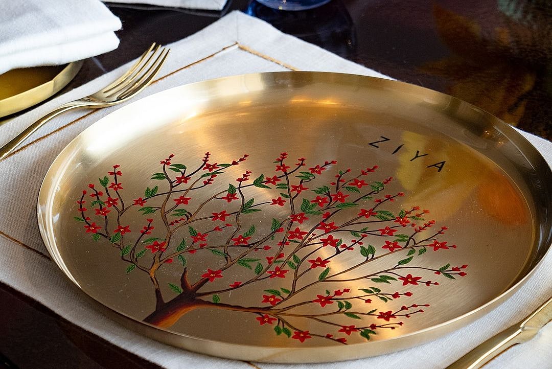 The restaurant uses brass plate as part of its sustainable offerings