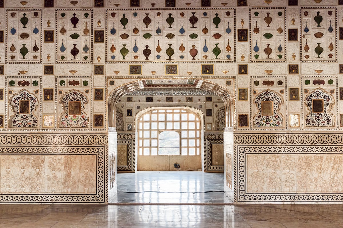 The walls of the dazzling Sheesh Mahal are plastered with intricate mosaics of mirrors and coloured glass
