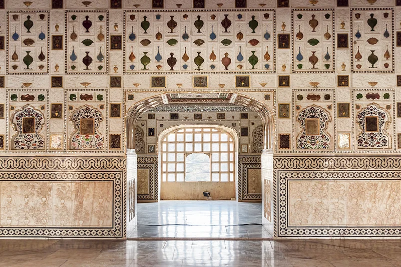 The walls of the dazzling Sheesh Mahal are plastered with intricate mosaics of mirrors and coloured glass