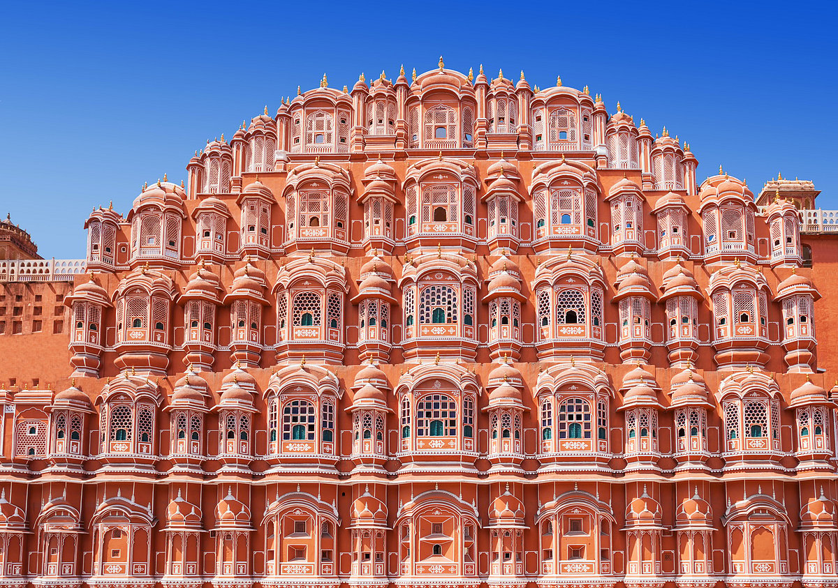 The small latticed windows of the Hawa Mahal, called jharokhas, resemble the crown of Lord Krishna
