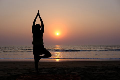 Bring a yoga mat and settle down for some simple asanas on the beach in the evening