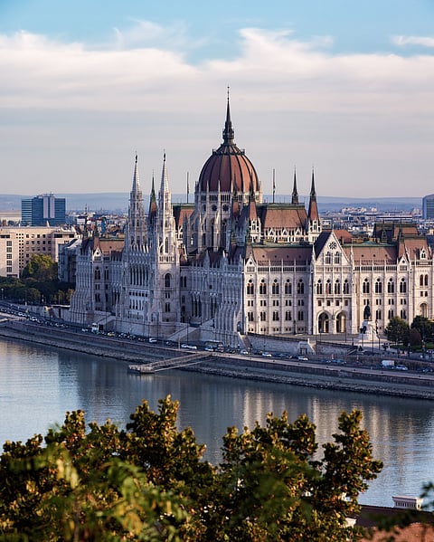 the broad panorama of the Danube is dominated by the imposing bulk of the Hungarian Parliament building