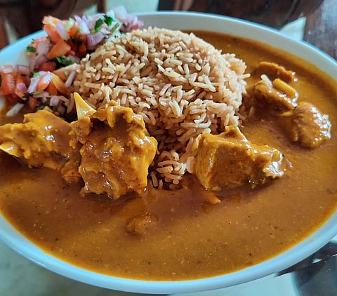 Mutton dhansaak with kachumber salad and rice