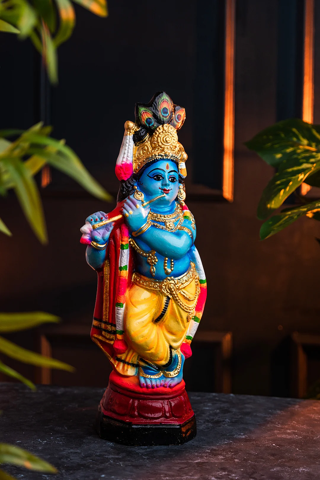 A Lord Krishna figurine kept on a table