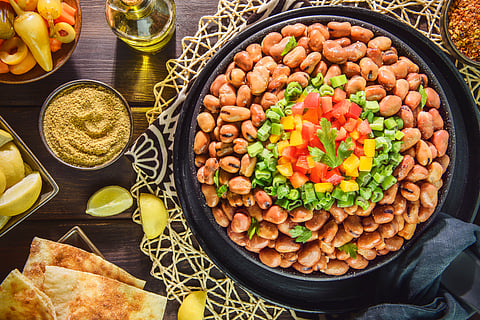 Ful medames is a stew of cooked fava beans served with olive oil and cumin