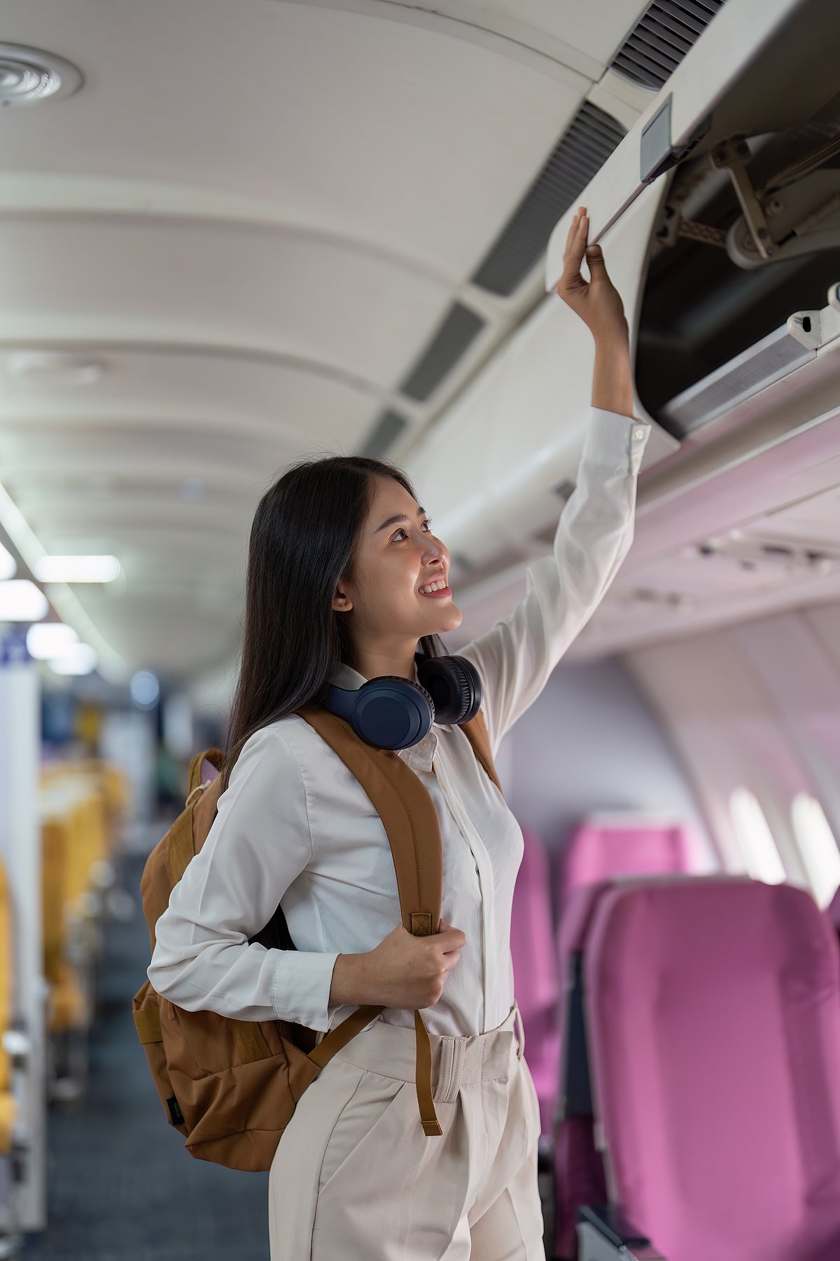 Shutterstock : A woman in an aeroplane