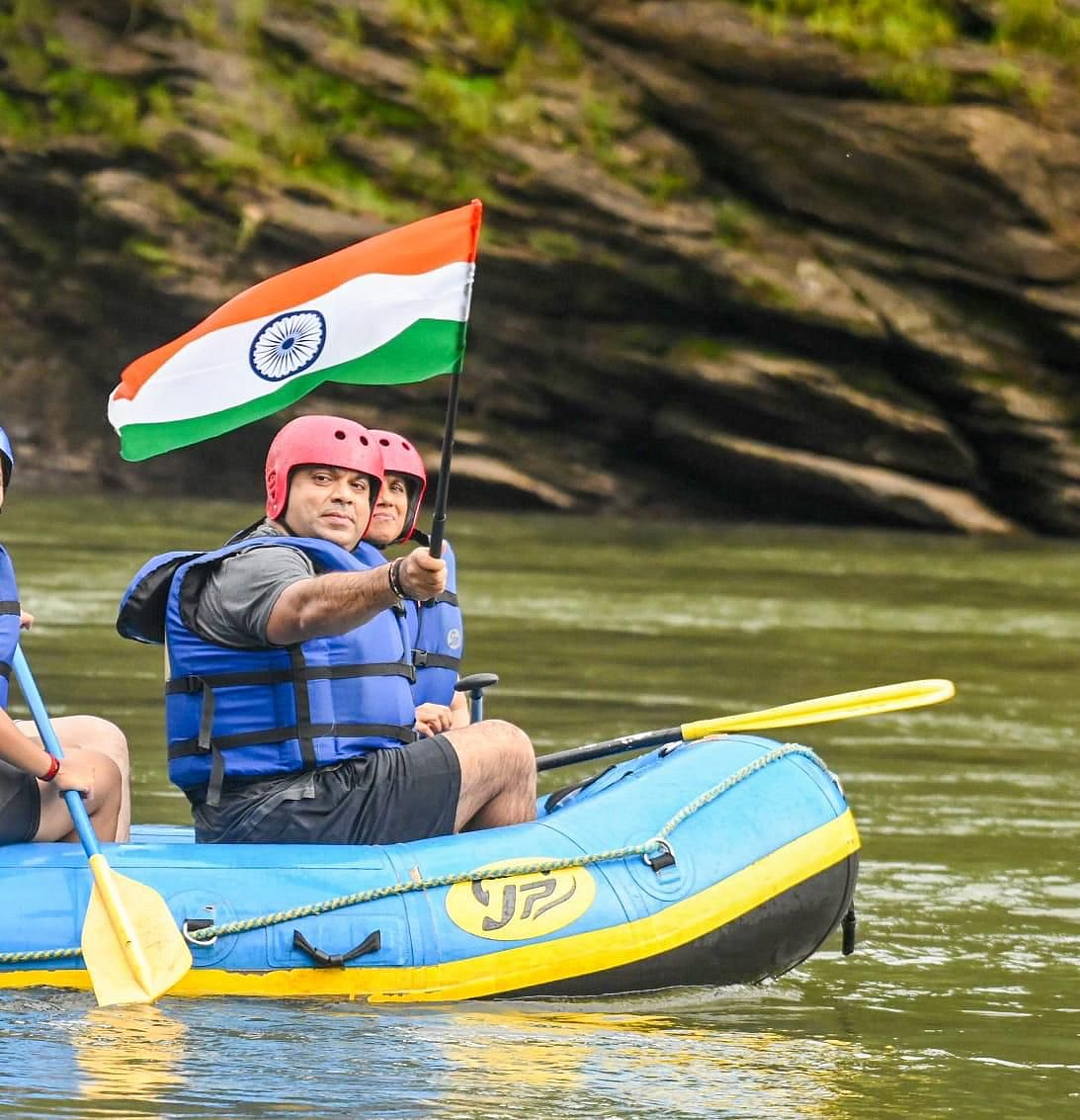 Rohan A Khaunte flies the Indian tricolour after the white water rafting experience