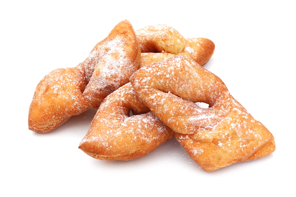 Bugnes lyonnaises is a thinly spread-out dough that is knotted once or twice