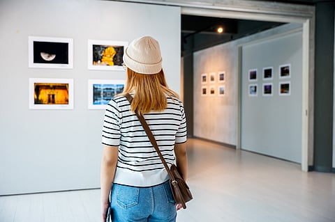 A woman at an art exhibition