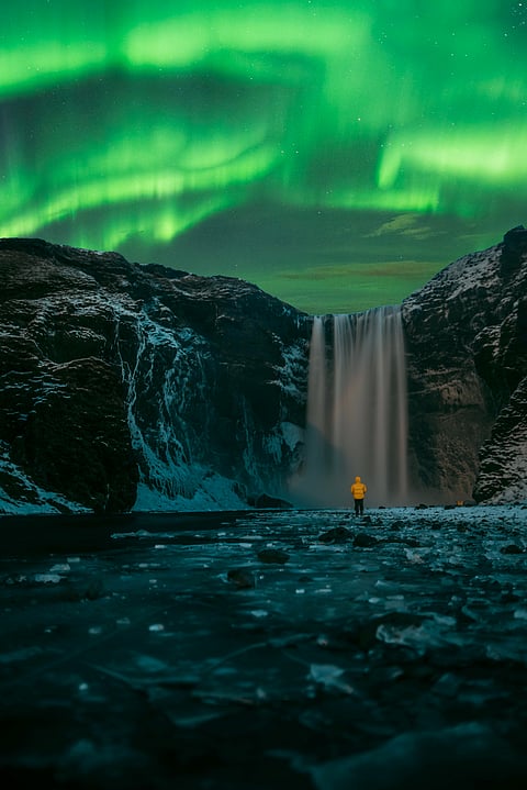 Northern Lights over Skógafoss Waterfall, Iceland