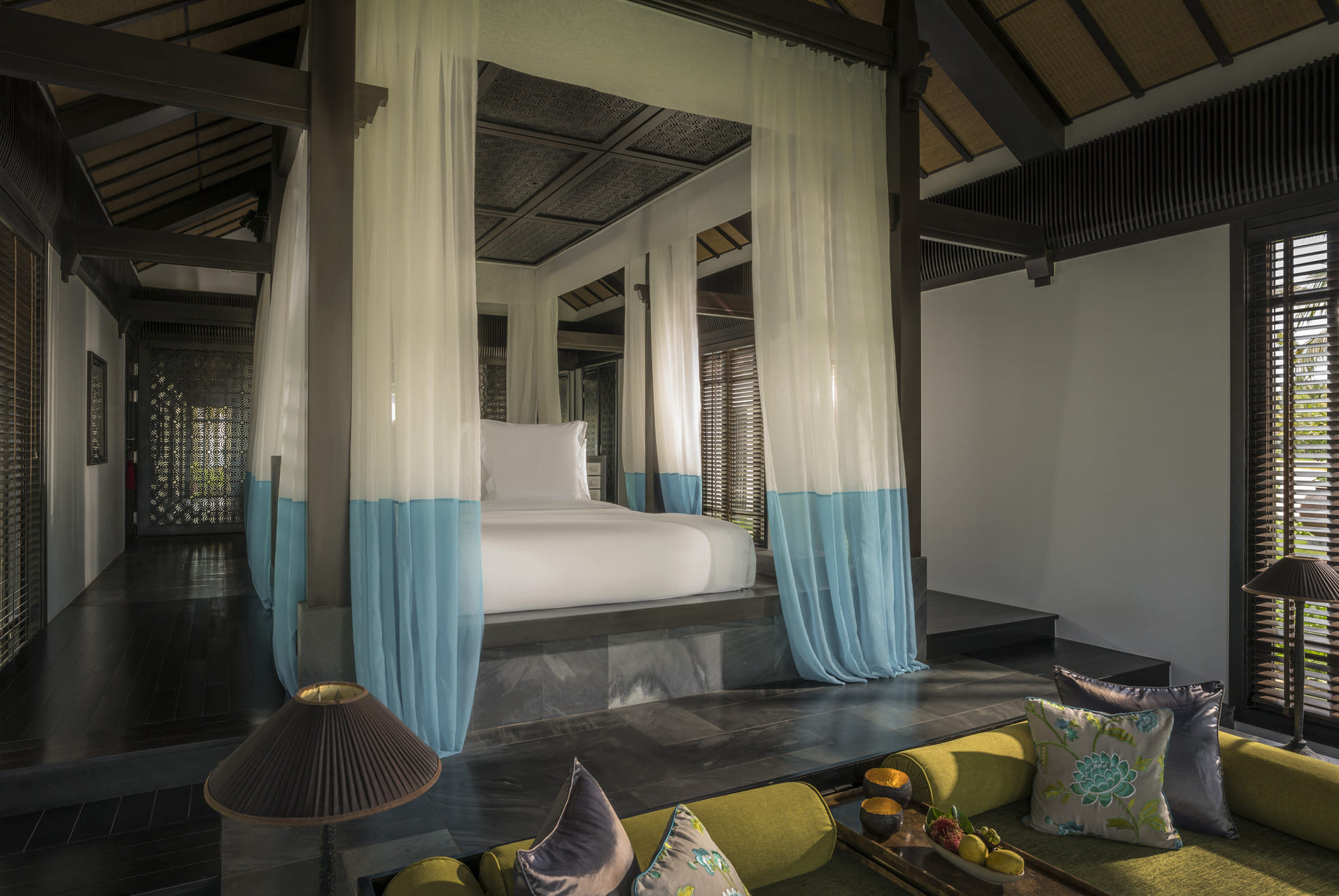 The roomy king bed veiled in gossamer nets