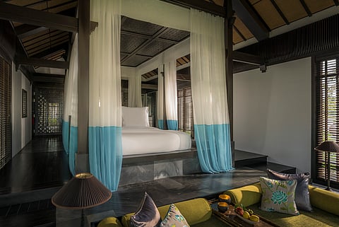 The roomy king bed veiled in gossamer nets