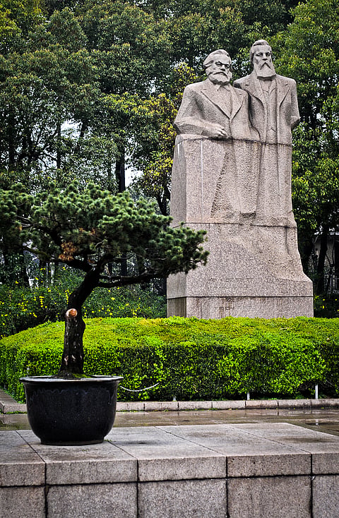 Statue of Karl Heinrich Marx and Friedrich Engels in Fuxing Park in the former French Concession of Shanghai in Luwan District