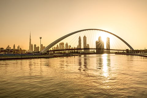 Sunrise over the Tolerance Bridge at the Dubai Water Canal
