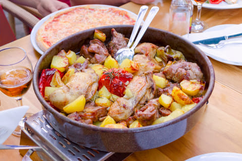 Peka is a Croatian dish made by slow-cooking meat, vegetables and herbs in an iron dome over hot coals