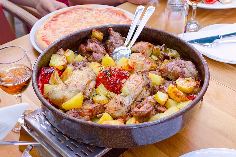Peka is a Croatian dish made by slow-cooking meat, vegetables and herbs in an iron dome over hot coals