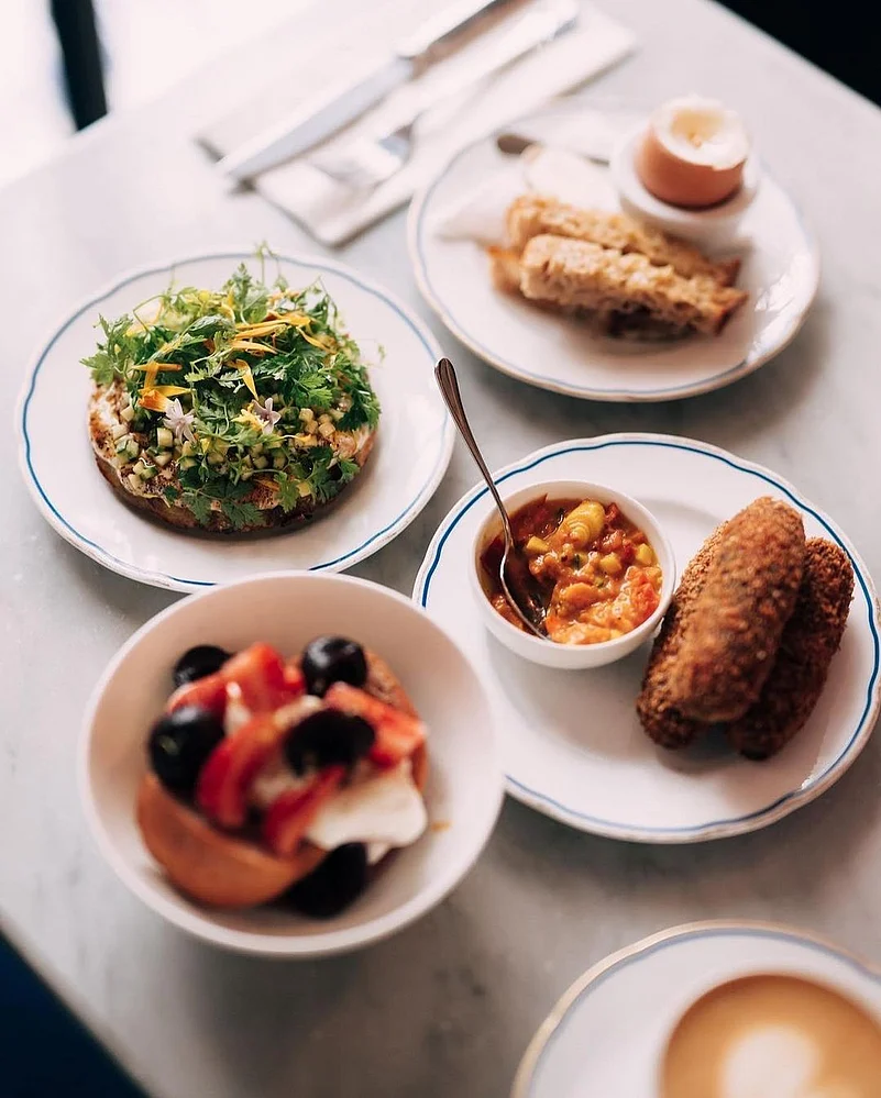 HB19s menu features star dishes like soft-boiled eggs with buttery mouillettes, gravlax, and more