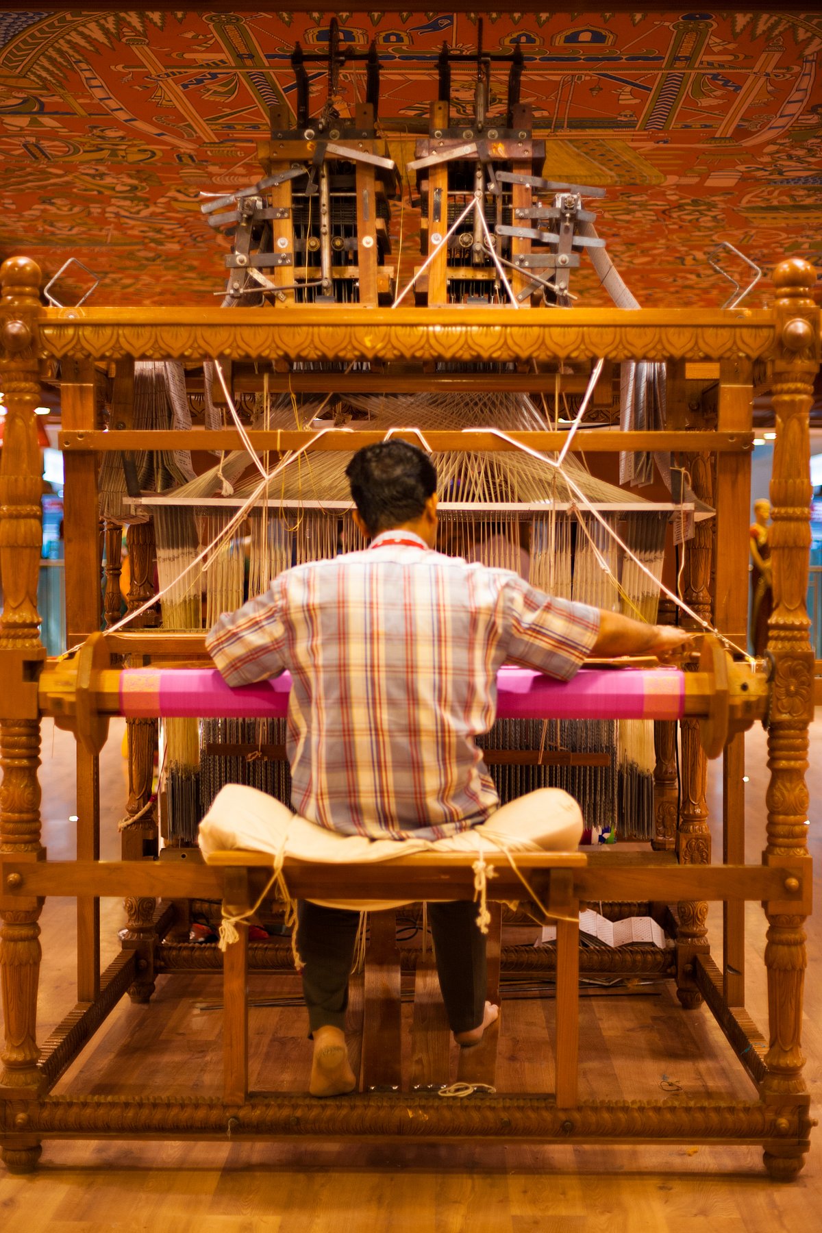 Shutterstock : A handloom worker sits at his workplace