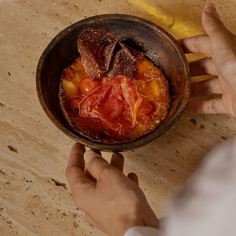 Tomatoes of Tomorrow is a zero waste dish with a creamy stracciatella at the base, confit tomato, topped with tomato jerky and tomato skin