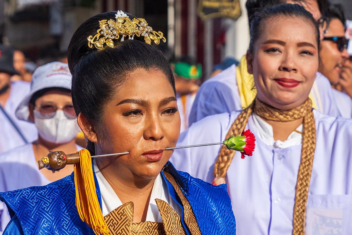 Participants in the Phuket Vegetarian Festival often indulge in acts of self-mutilation in order to purify and cleanse themselves of sin