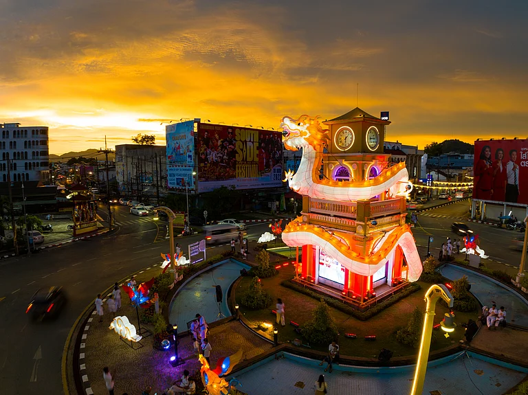 Beautiful dragon monument at night during the Phuket Vegetarian Festival - Shutterstock