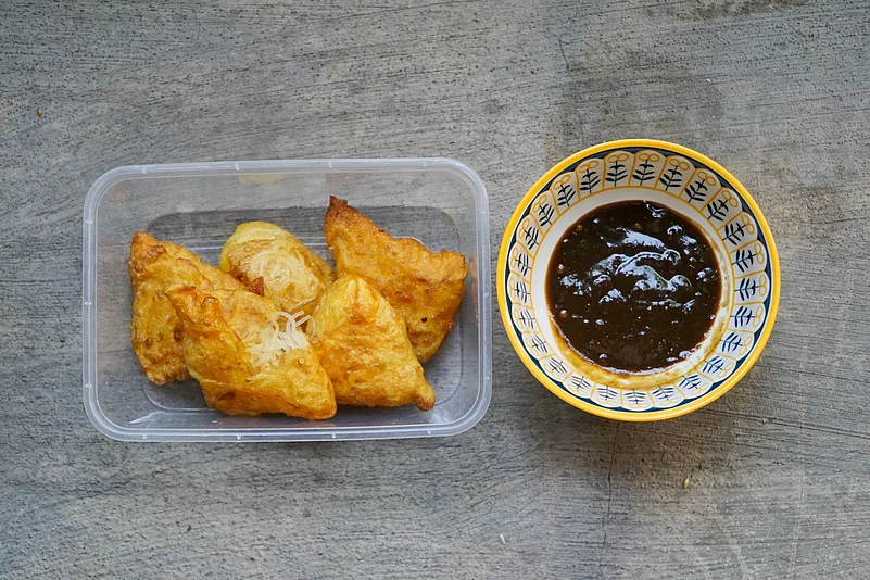Indonesian samosas are often enjoyed as snacks, accompanied by the spicy kick of sambal