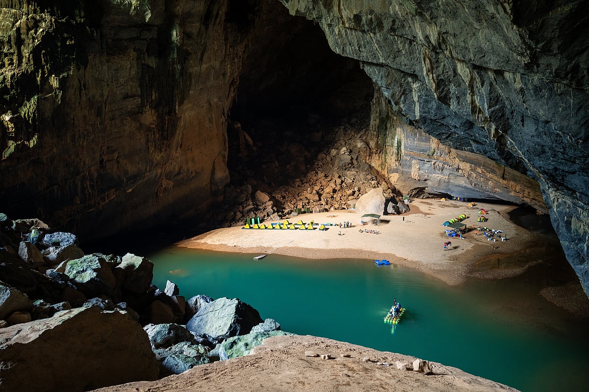 The highlight of a trek inside Hang Én is camping on a sandy beach beside an emerald pool