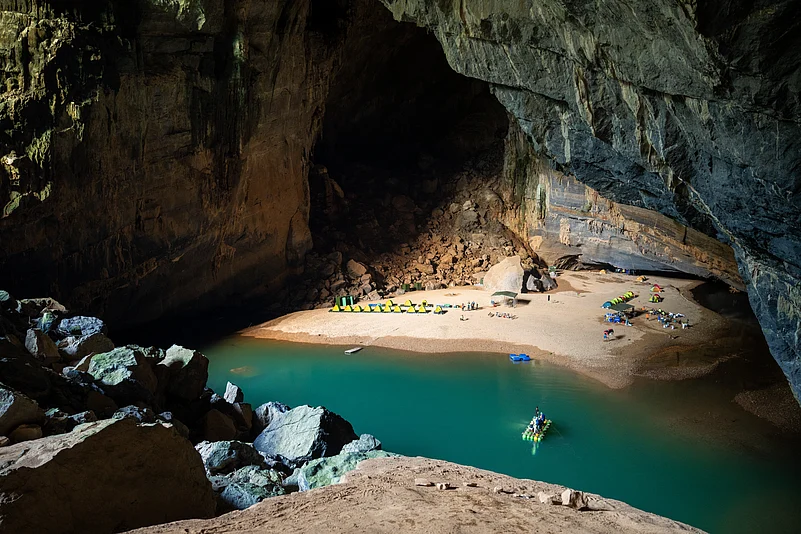 The highlight of a trek inside Hang Én is camping on a sandy beach beside an emerald pool