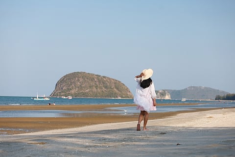 Take a stroll on Hua Hin beach's white sands