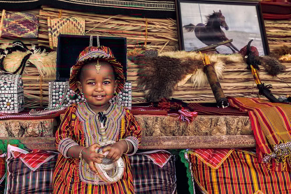 An Omani girl wearing ancient Omani dress 