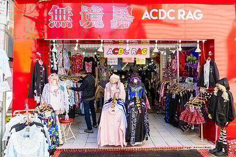 Racks of fashionable Gothic-lolita dresses and clothing outside the entrance to the famous ACDC Rag store on Takeshita Street